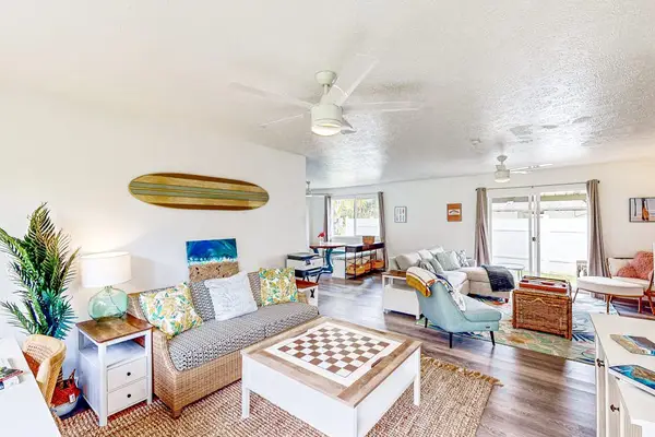 Living room with plenty of seating for relaxing on the sofa bed or a table for having a game night.