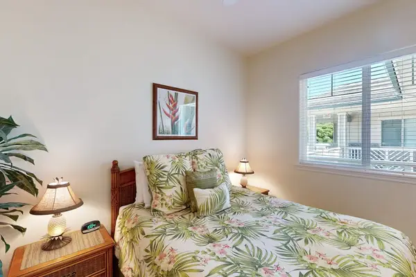 Bright Guest Bedroom with Windows & Tropical Bedding