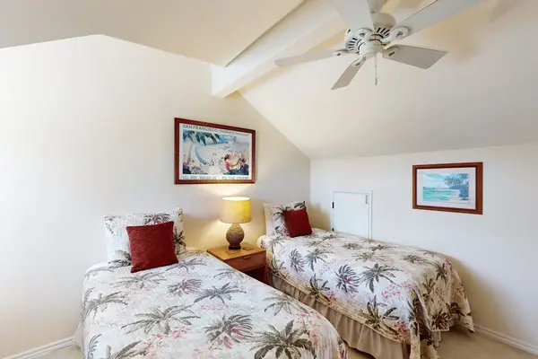 Loft Bedroom Setup with Two Beds & Vaulted Ceilings