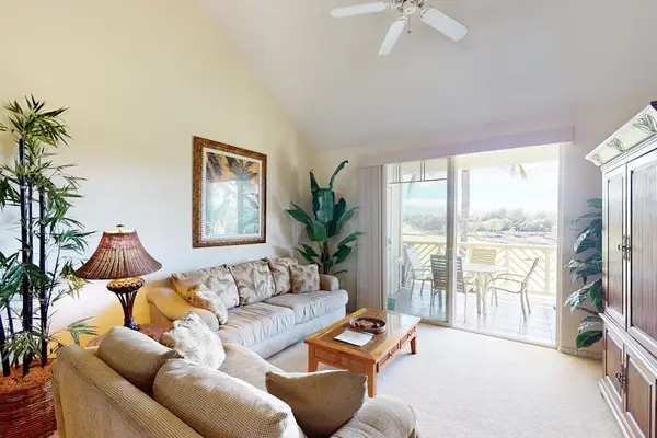 Spacious Living Room with Vaulted Ceilings & Balcony Access