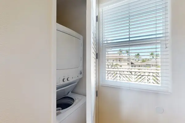 In-Unit Stacked Washer & Dryer Closet