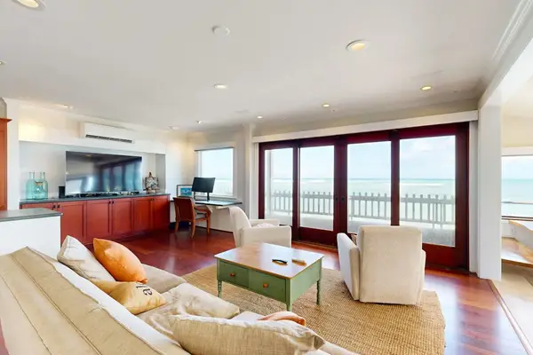 Relax indoors surrounded by stunning water views through expansive glass walls daily