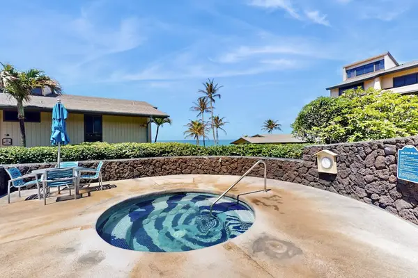 Soothing Resort Jacuzzi Surrounded By Lush Greenery