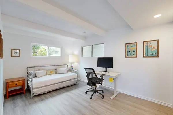 Stay productive and flexible in a room featuring a workspace and adaptable sleeping arrangements.