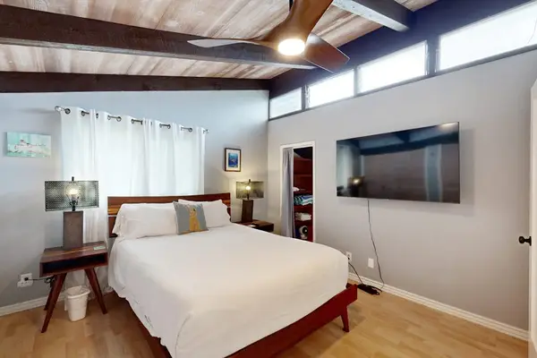 Make yourself at home with a comfortable bed, TV, and ceiling fan.