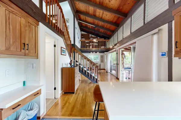 Prepare meals, gather, and enjoy added workspace in this roomy kitchen.