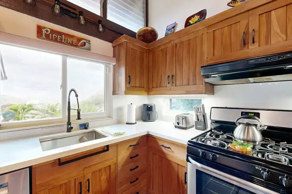 Prepare meals while enjoying peaceful views of the lush garden.