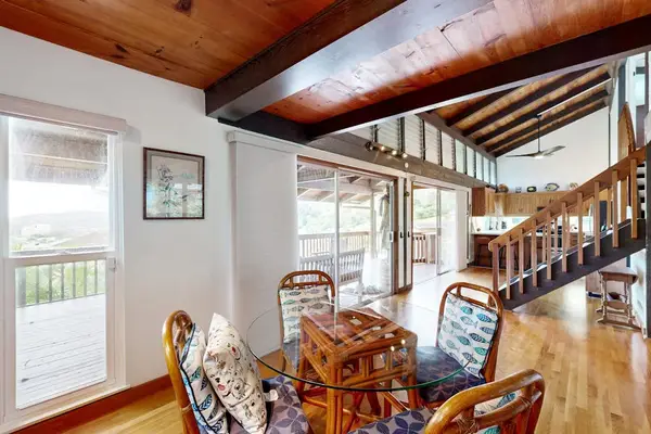Enjoy sunlit meals in a welcoming dining area filled with tropical charm.