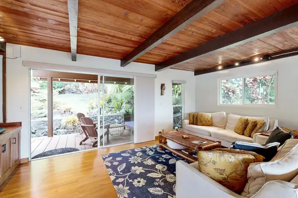 Enjoy an airy living room with wide doors that create a welcoming sense of openness.