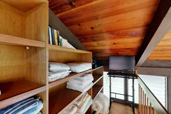 Settle in easily with fresh linens and practical storage space close at hand.