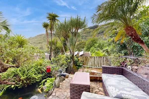 Relax in a lush garden oasis while enjoying beautiful views of the surrounding mountains.
