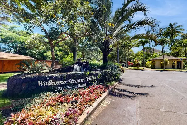 Welcoming entrance framed by lush gardens