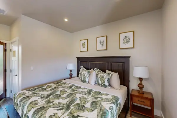 Warmly Lit Bedroom Nook with Dark Wood Headboard & Side Tables