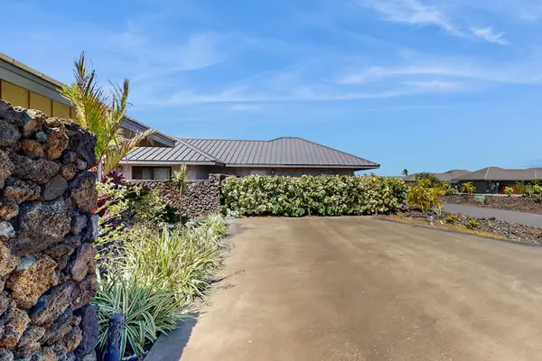 Driveway Approach & Exterior Wall with Tropical Hedging