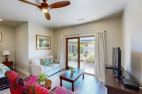 Bright Studio Living Space with Seating Area & Sliding Patio Doors