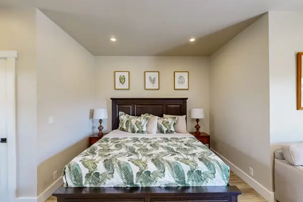 Cozy Bedroom Nook Featuring Tropical Palm Bedding & Framed Art