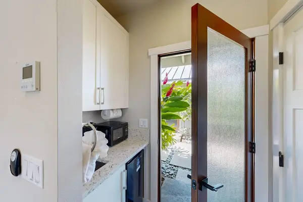 Entryway View of Kitchenette Corner with Upper Cabinets & Counter Space