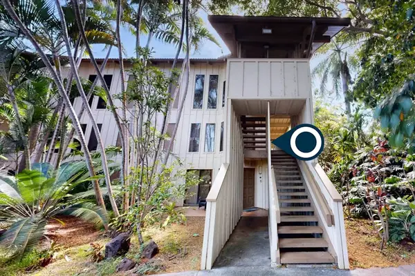 Charming building surrounded by tropical landscaping