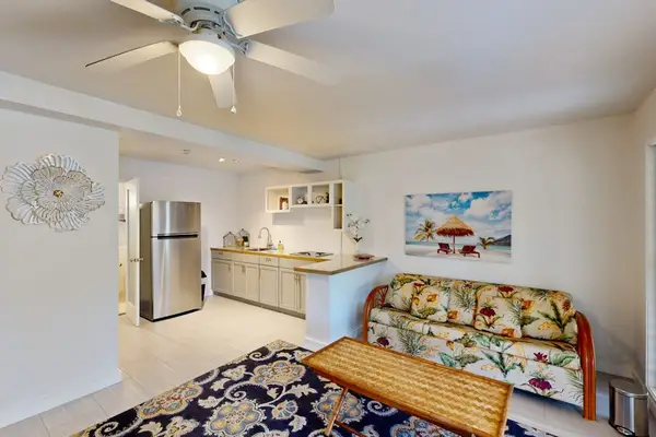 Living area features sofa seating ceiling fan and garden outlook