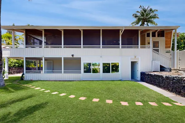 Spacious lawn offers Side yard walkway connects landscaped grounds with covered home accessstepping stones and views of the home