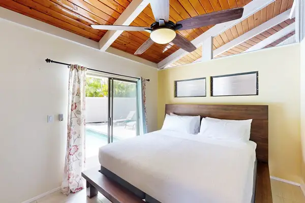 First bedroom offers king bed single bed ceiling fan windows
