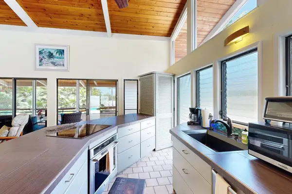 Gourmet Kitchen Prep Area with Modern Appliances & Garden Views