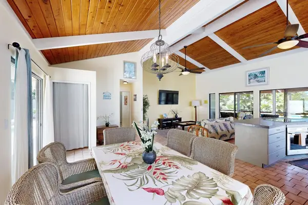 Open-Concept Living & Dining Space with Soaring Wood Ceilings