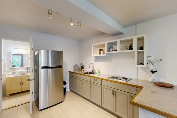 Modern Kitchen with Stainless Steel Refrigerator & Ample Counter Space