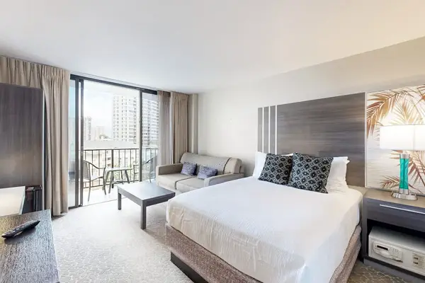 Relax and unwind in a welcoming space featuring a comfortable queen bed and an additional full-size sofa bed.