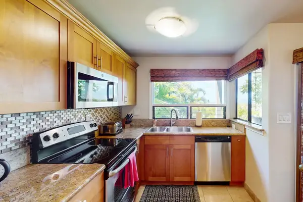 Spacious kitchen with dining access for shared meal