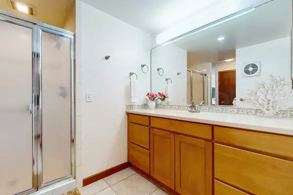 Modern full bathroom with a spacious vanity and walk-in shower