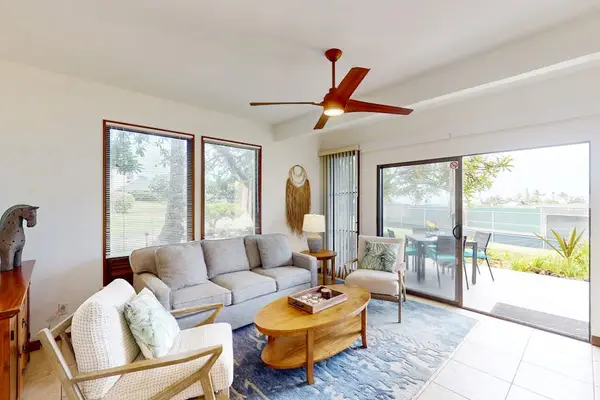 Bright living room with comfortable seating and garden view