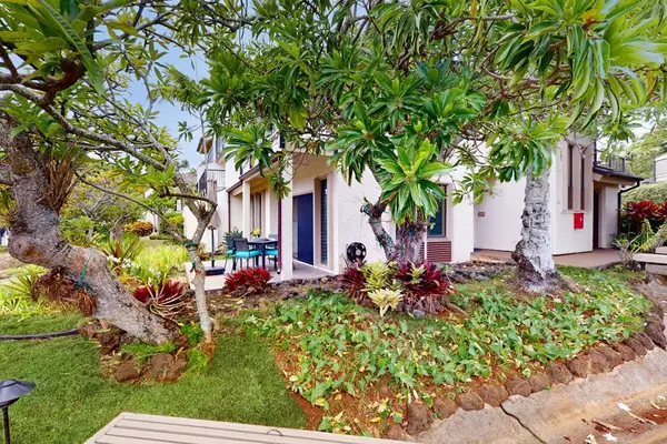 Beautifully maintained grounds with tropical greenery