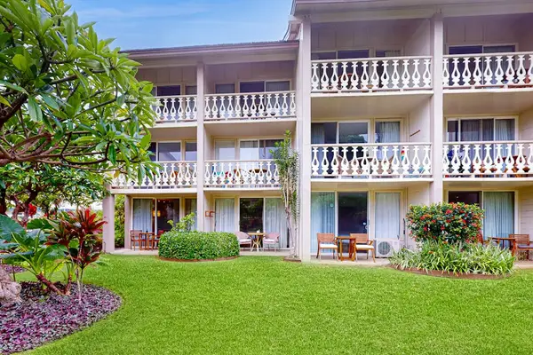 Charming Island Building Surrounded By Gardens