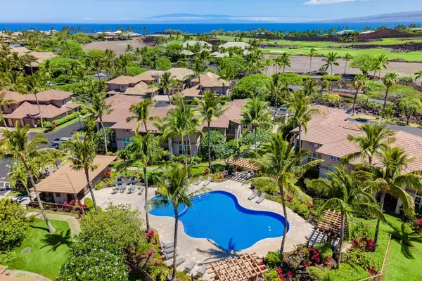 Panoramic Aerial Vista Of Lush Resort Grounds And Pool