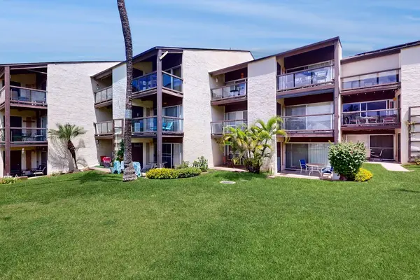 Beautiful Resort Exterior Surrounded By Palms