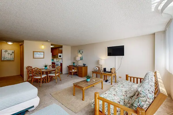 Relax in the cozy living area with comfortable seating, a Smart TV, and easy access to the sleeping space.