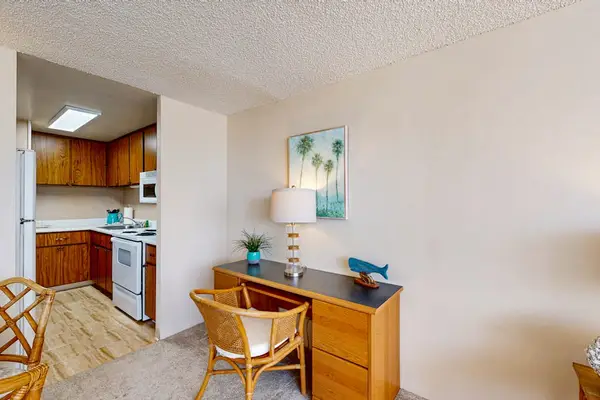 Dedicated workspace and dining area conveniently located beside the fully equipped kitchen for added comfort during extended stays.