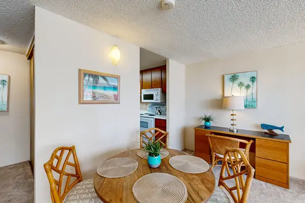 Dining space comfortably seats four guests and flows effortlessly into the kitchen and open studio living area.