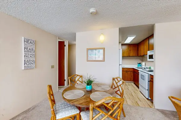 Enjoy meals together in the dining area with convenient access to the fully equipped kitchen.