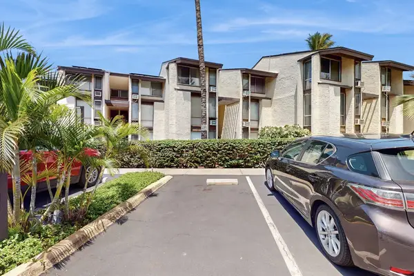 Welcoming resort entrance with guest parking