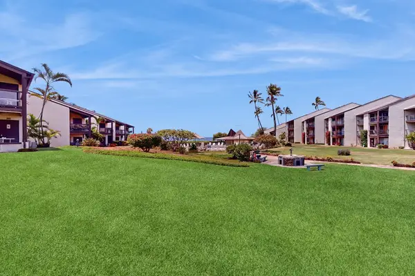 Expansive green lawn with resort views