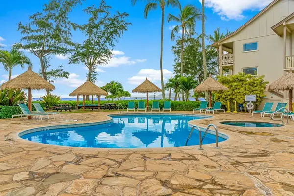 Refreshing pool surrounded by palms