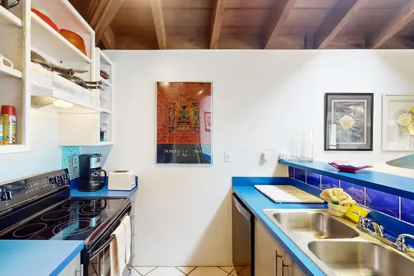 Bright kitchen features generous counters and practical meal preparation space