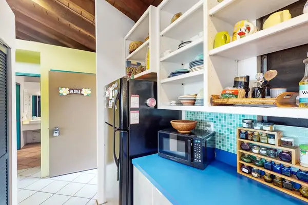 Kitchen workstation offers organized storage and convenient meal preparation surfaces