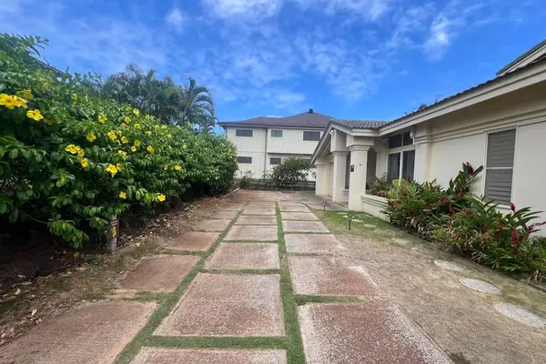 Stroll through beautiful landscaping before heading inside