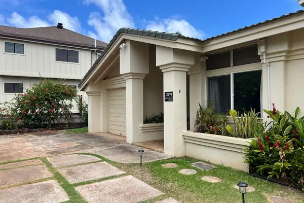 Front entrance surrounded by well-kept landscaping