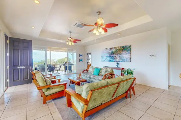Relaxing lounge offers comfortable seating beside scenic island views indoors