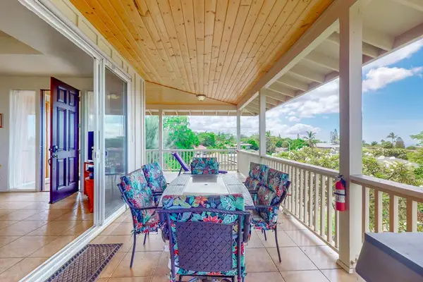 Spacious balcony invites outdoor relaxation with comfortable seating and beautiful surrounding views daily
