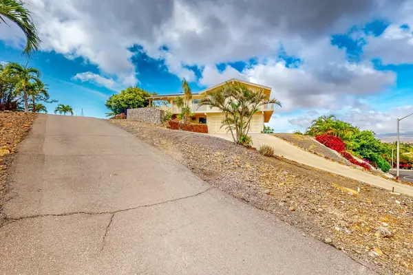 Driveway provides easy arrival with convenient parking for guests onsite